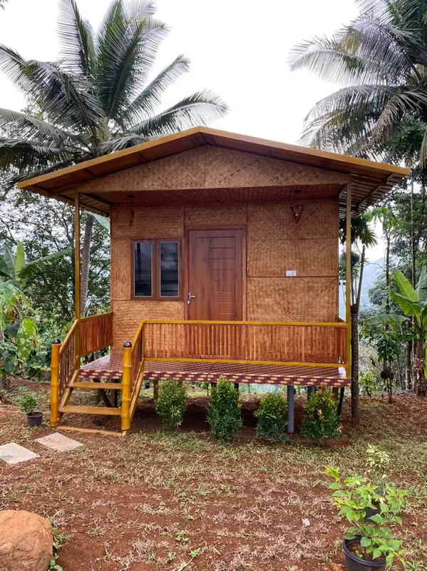 Bamboo Hut couple room among coconut palms at Purayil Resort
