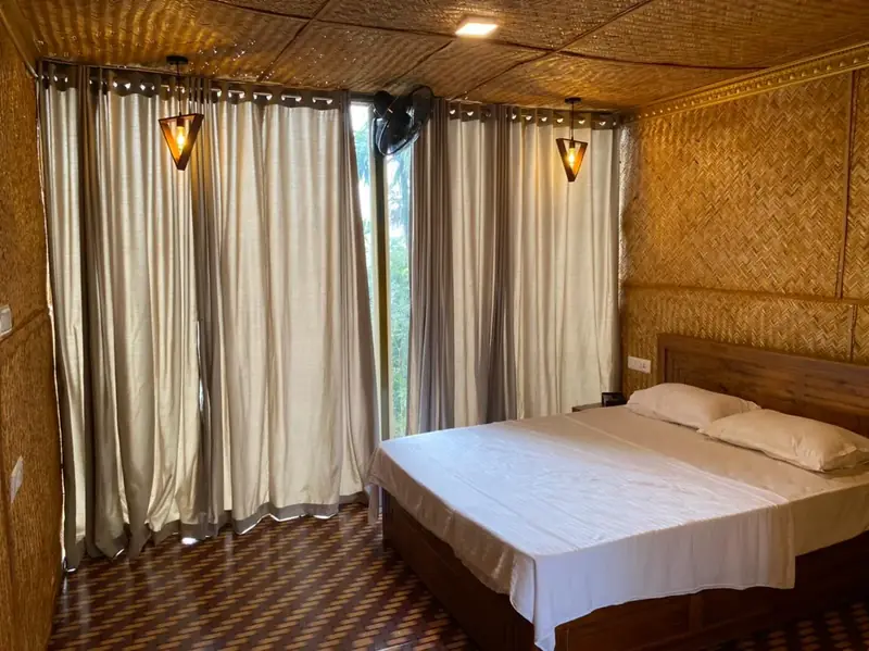 Bamboo Hut room with curtains and lamps