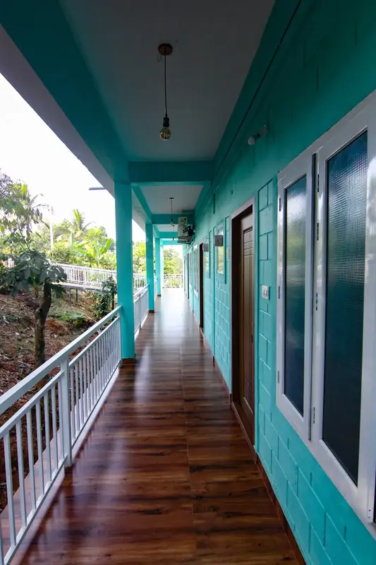 Long wooden balcony of the first floor Capsule Villa