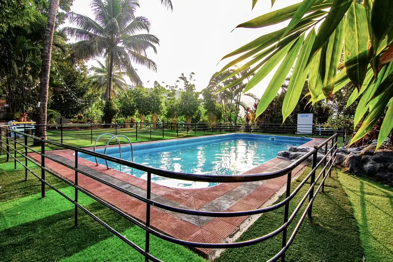 Wide view of the swimming pool at Purayil Resort, Kakkadampoyil